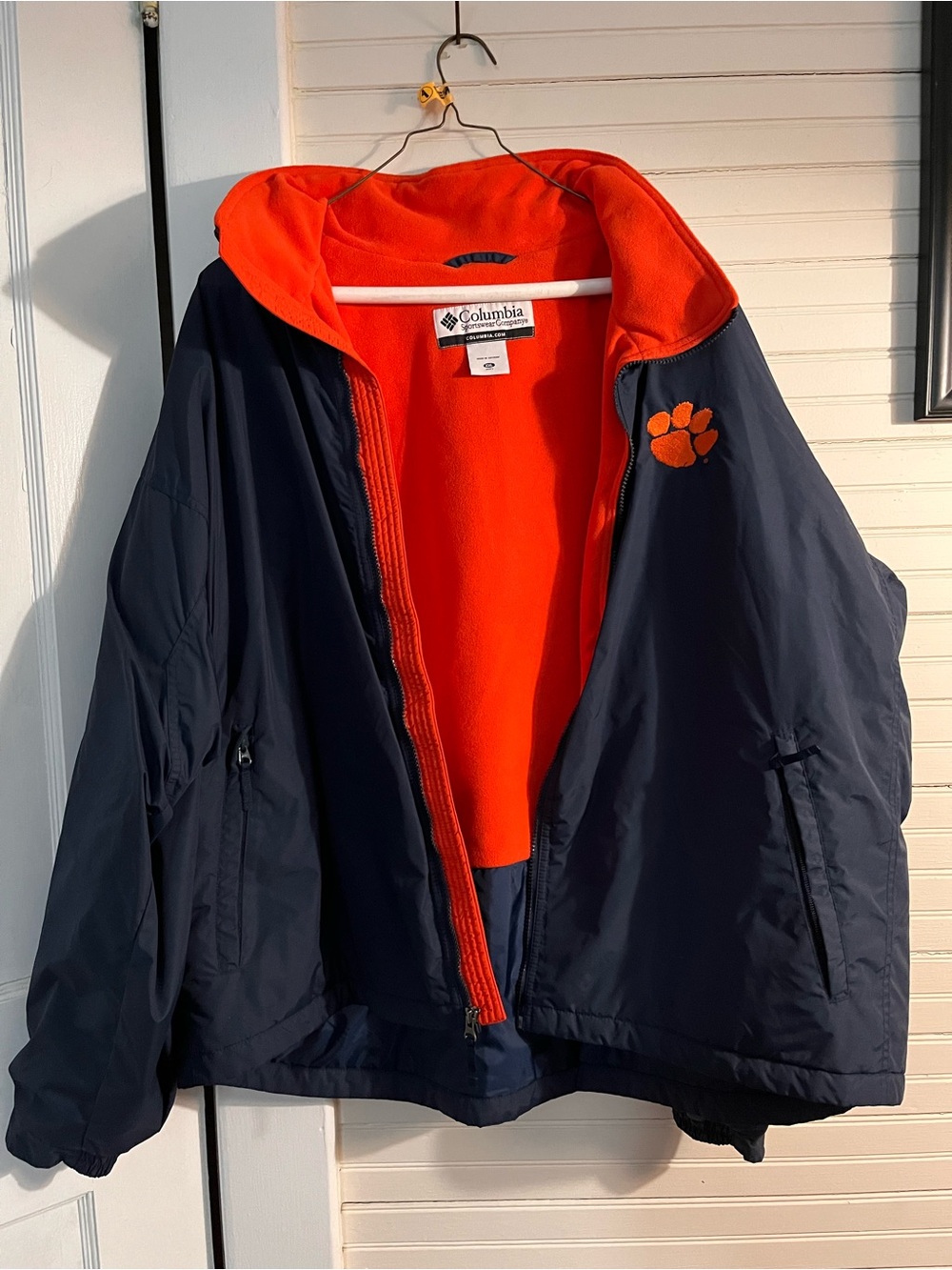 Columbia Navy Jacket with Orange Fleece Lining and Paw Patch